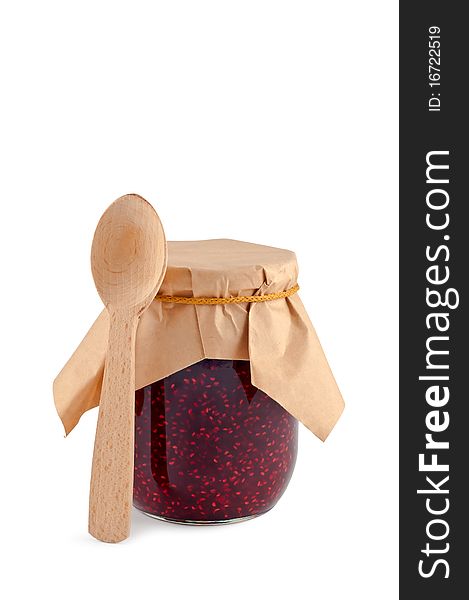 Jam in jar wooden spoon isolated.