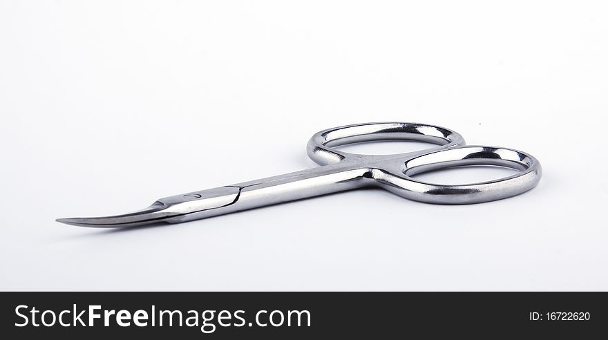 Scissors for manicure close up on a white background