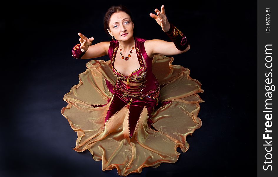 Woman in arabic dance look at you - studio shot. Woman in arabic dance look at you - studio shot