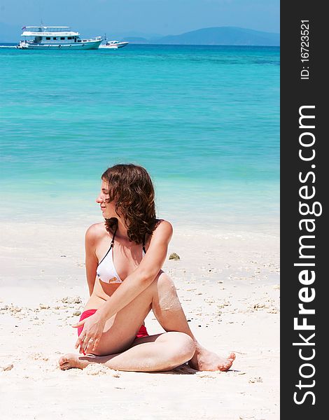 Woman meditating at the beach