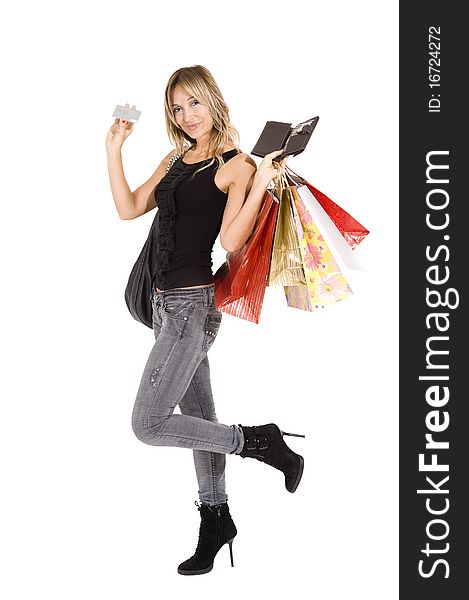 blond woman with shopping bags smiling happily. blond woman with shopping bags smiling happily