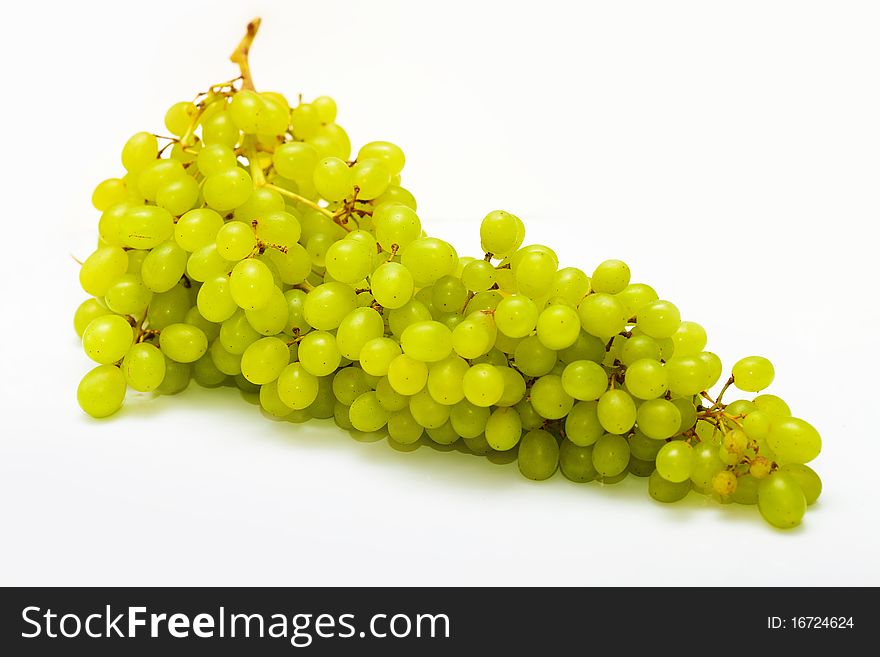 Bunch of ripe grapes on a white background