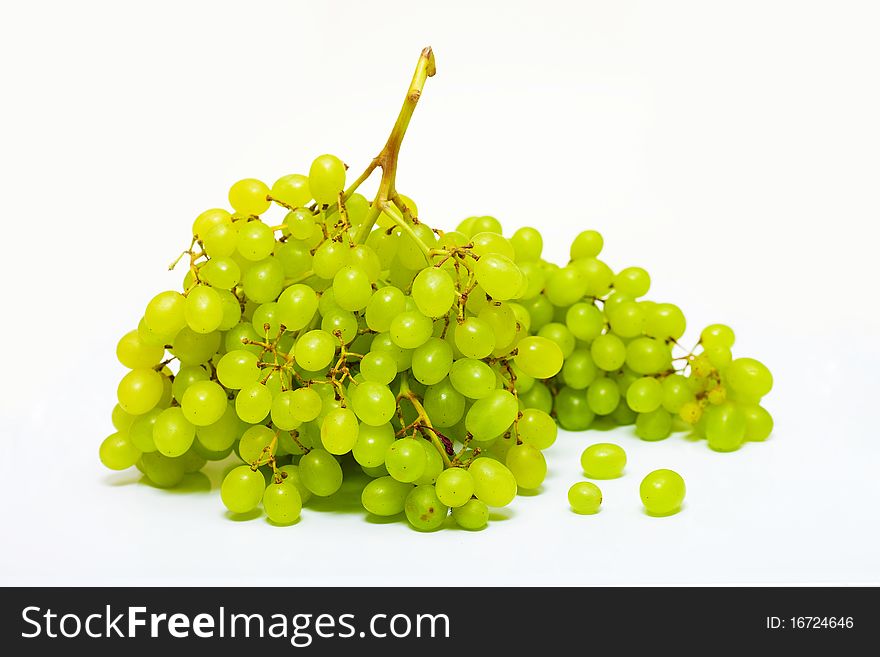 Bunch of ripe grapes on a white background