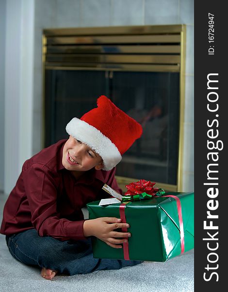 Boy In Santa Hat With Gift