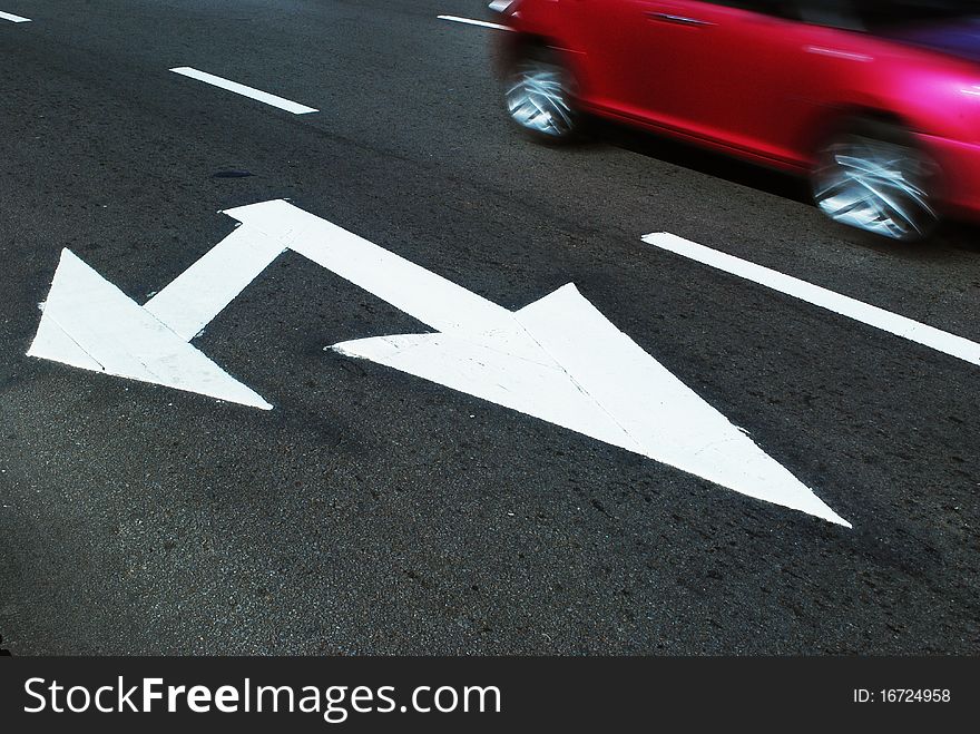 Arrow sign on road