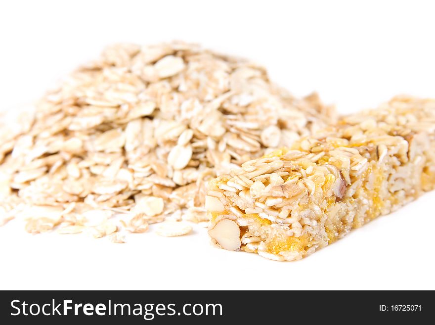 Muesli snack stick and oat flakes