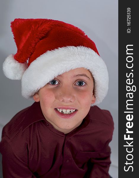 Close Up Of Boy With Santa Hat