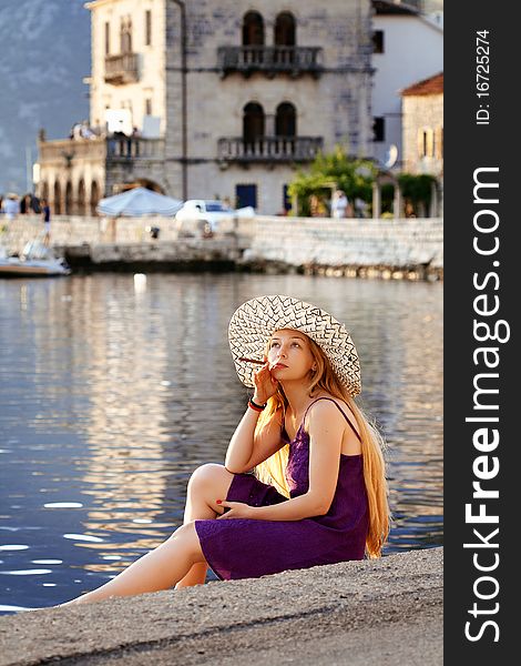Beautiful woman relaxing by the sea in Montenegro