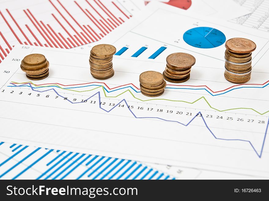 Graphs and charts with stacks of coins. Graphs and charts with stacks of coins