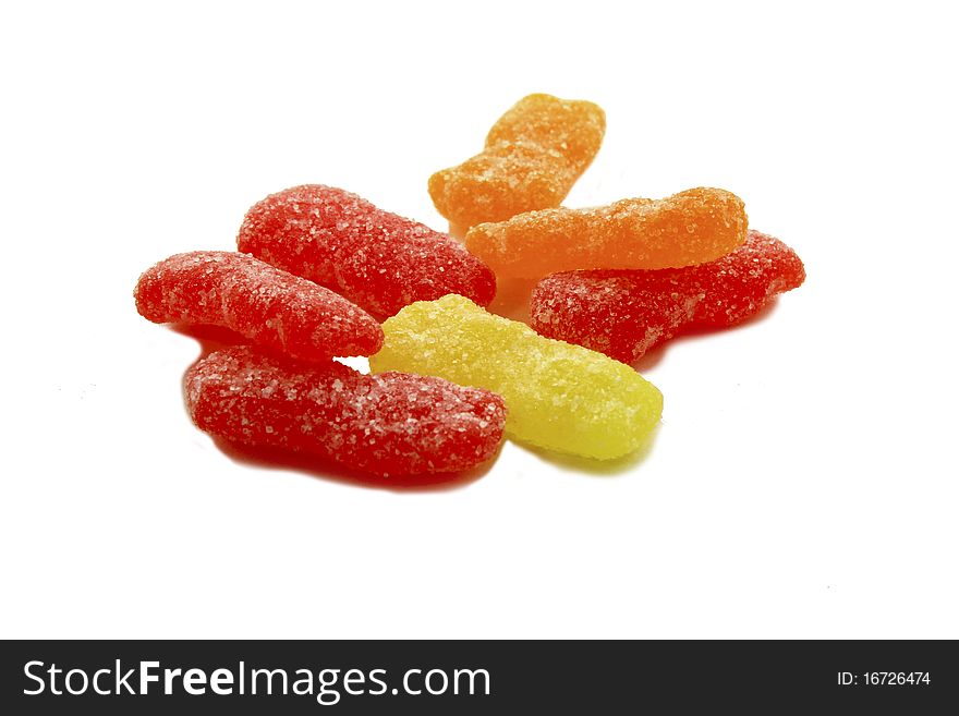 Sour sweet cut out candy on white background.