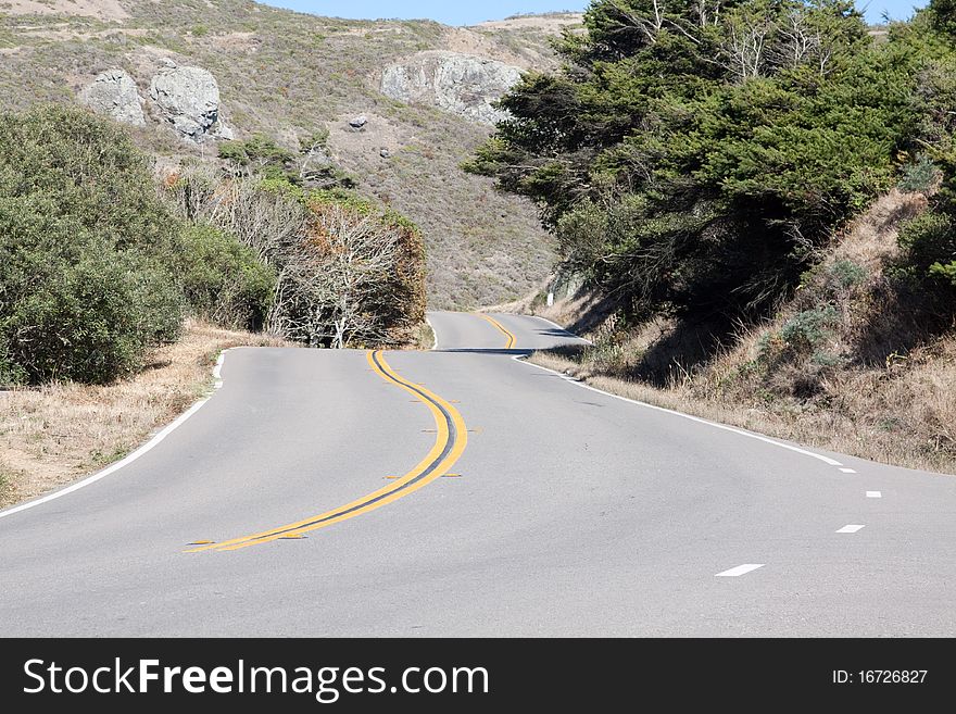 The picture shows a curved part of the legendary Highway 1 in California. The picture shows a curved part of the legendary Highway 1 in California