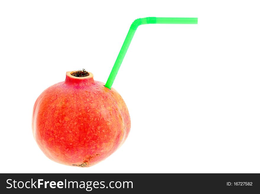 Ripe juicy pomegranate with straw