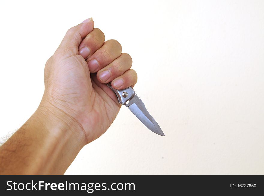 Hand holding a knife isolated on white background