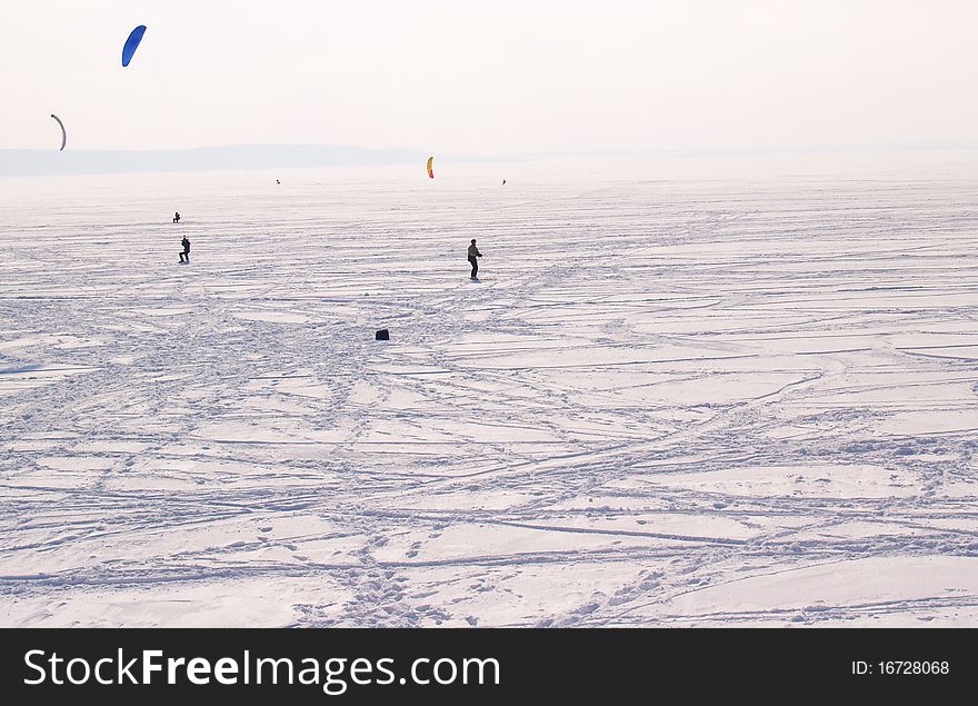 A view of Volga River in winter, Russia. parachute pumpers are on the river.