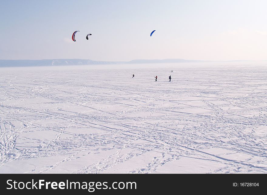 The parachute pumpers are on the Volga River in winter, Russia.