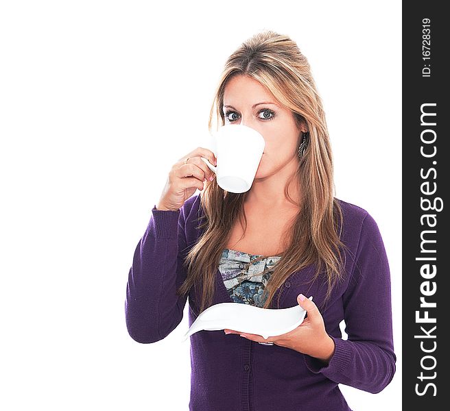 Young woman drinking coffee on white background