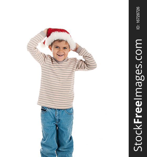 Little boy in a santa claus hat on white