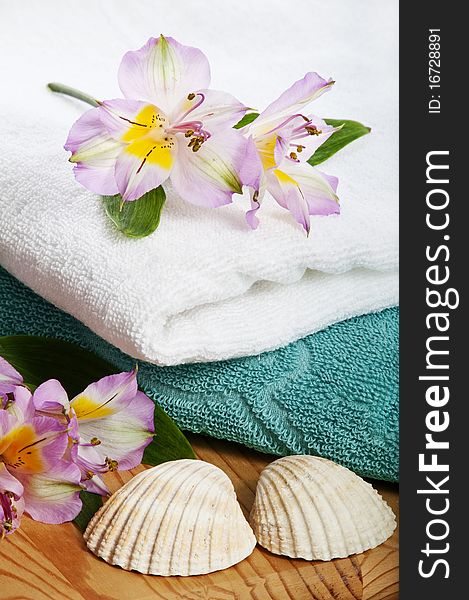 Towels And Floral Decoration In Spa