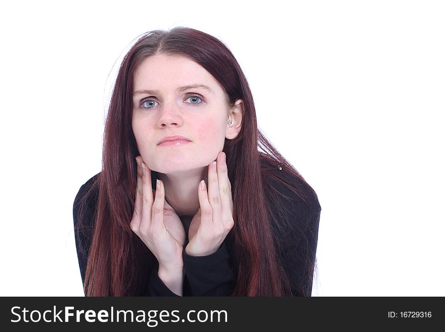 Young woman in studio resting chin on hands. Young woman in studio resting chin on hands
