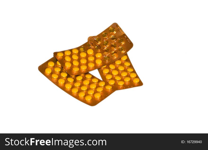Orange medicine pills isolated on white
