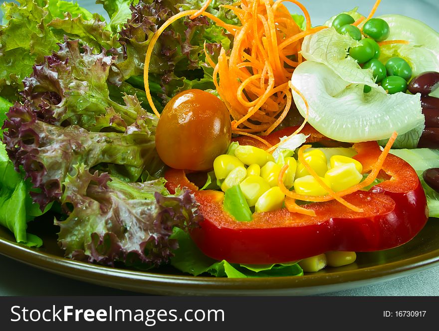 Salad on brown plate have an many vegetarian