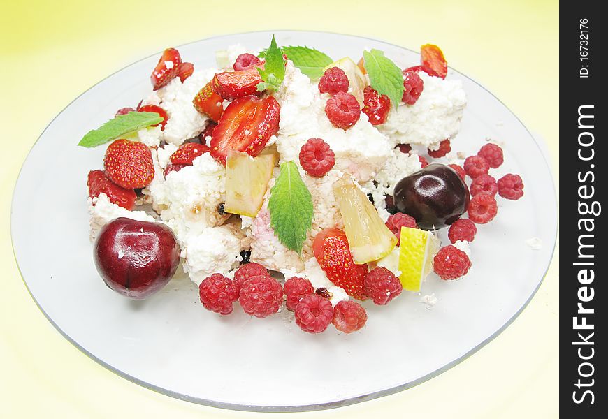 Fruit salad with curd strawberry cherry raspberry and other fruits