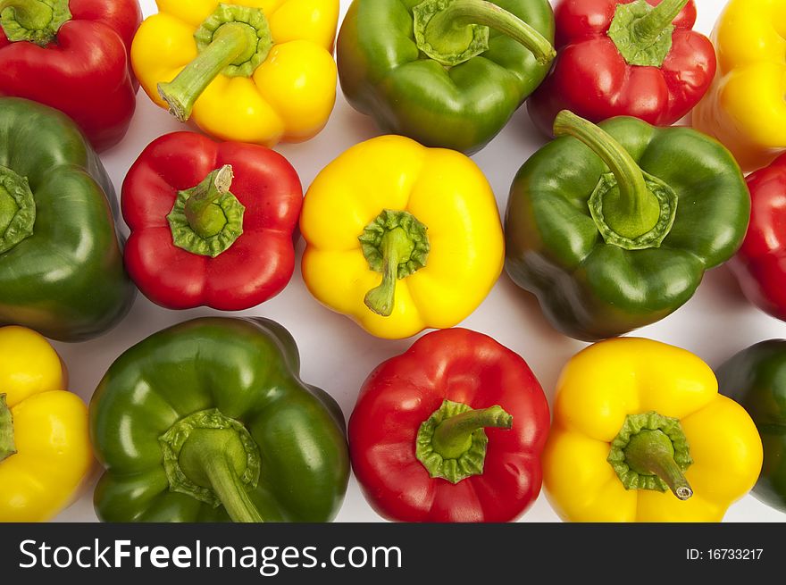 Colourful Peppers On The White Background