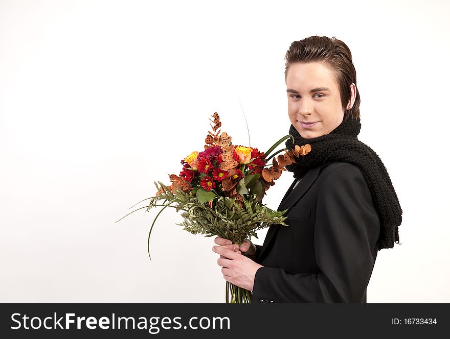 Teenager holding a bunch of flowers on white background. Teenager holding a bunch of flowers on white background.