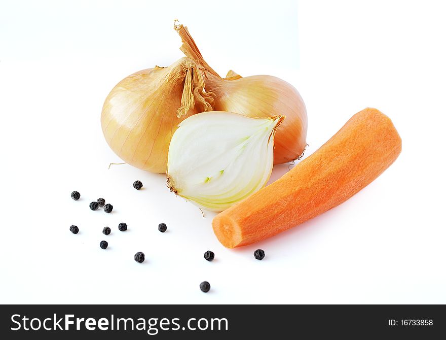 Onions, carrot and pepper prepared for cooking on white background