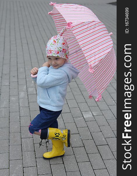 Little girl with pink umbrella. Little girl with pink umbrella