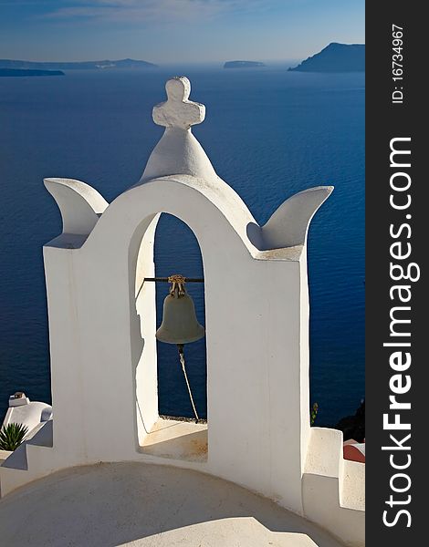 Bell tower of small church in Oia village, Santorini, Greece. Bell tower of small church in Oia village, Santorini, Greece.
