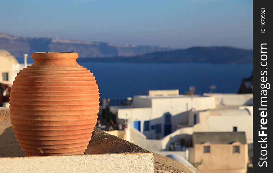 Traditional greek vase with spectacular caldera view on the background (Oia, Santorini, Greece). Traditional greek vase with spectacular caldera view on the background (Oia, Santorini, Greece)