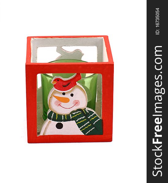 New Year's support of the snowman in scarf and cap with green candle. New Year's support of the snowman in scarf and cap with green candle