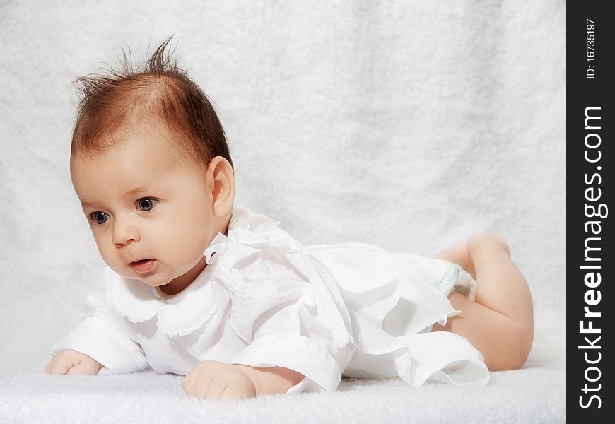 Newborn baby on white texture background