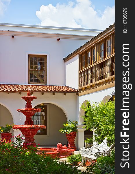 View of the spanish colonial style patio with red fountain in St. Augustine, Florida. View of the spanish colonial style patio with red fountain in St. Augustine, Florida