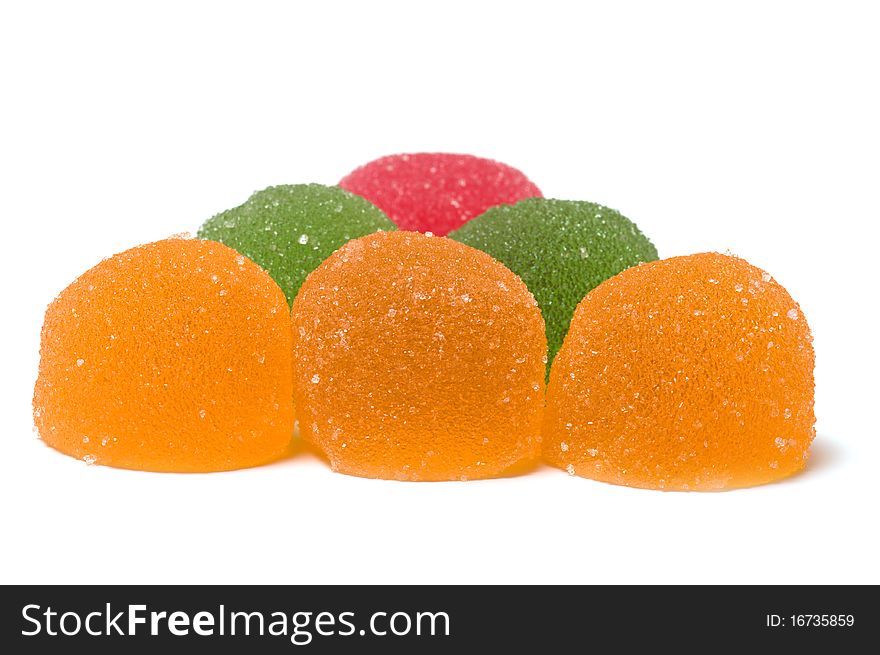 Multi-colored fruit candy on a white background. Multi-colored fruit candy on a white background.