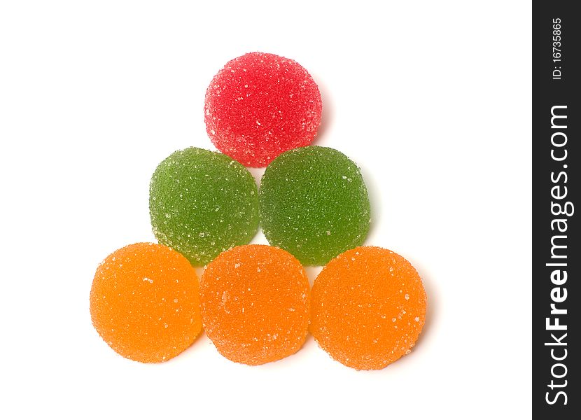 Triangle from color fruit candy on a white background. Triangle from color fruit candy on a white background.