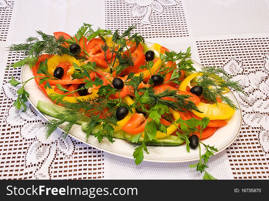 Photo of the cut vegetables lying on a white plate. Photo of the cut vegetables lying on a white plate