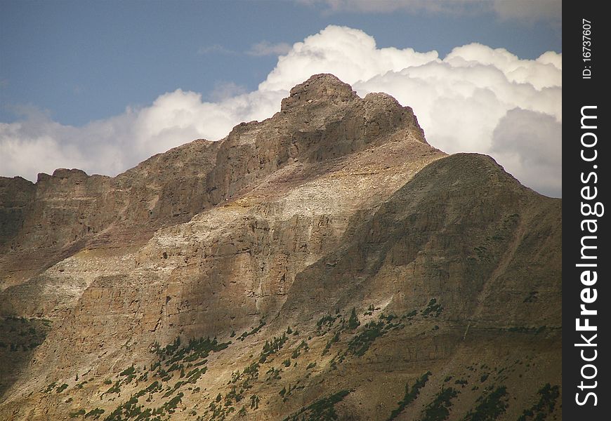 Hayden peak rises above Mirror lake. One of the thousands of small mountain lakes along Utah's scenic byway 150.