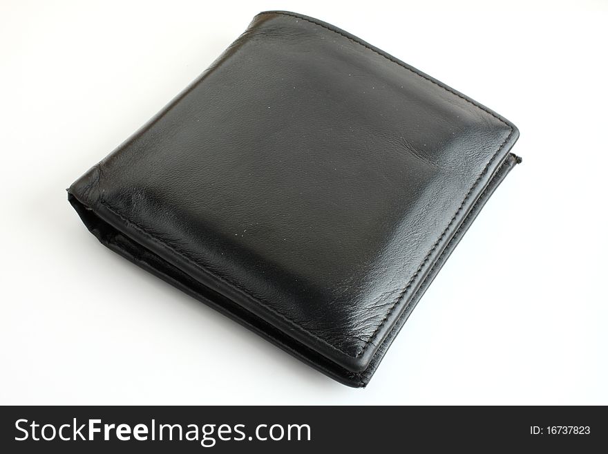 Black leather wallet on white white paper. Black leather wallet on white white paper.