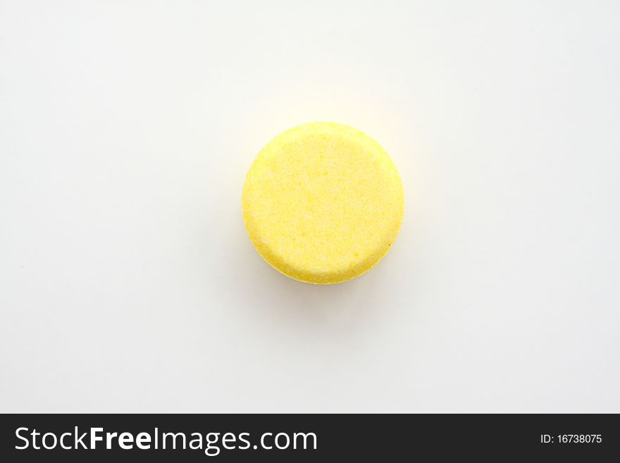 Yellow tablet for patient on white paper. Yellow tablet for patient on white paper.