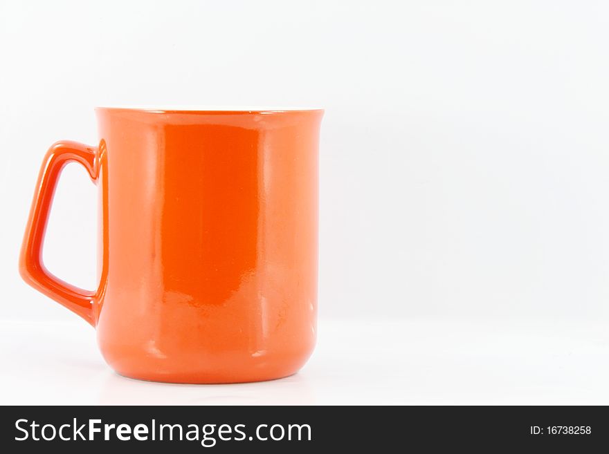 This is a Orange coffee cup.