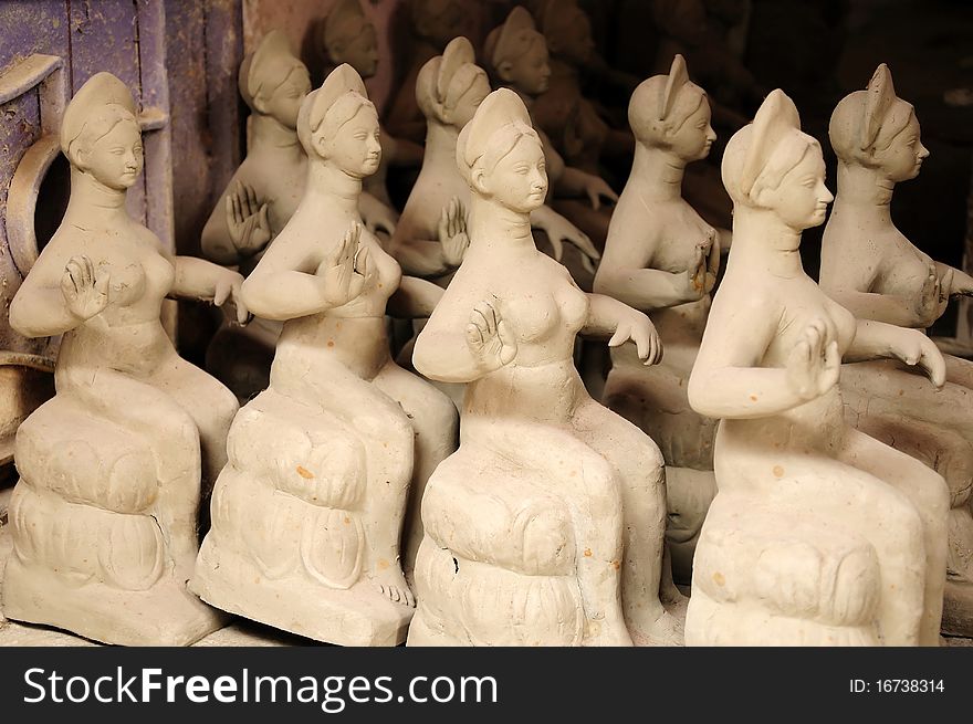 Rows of many clay idols kept for sale at a shop. Rows of many clay idols kept for sale at a shop