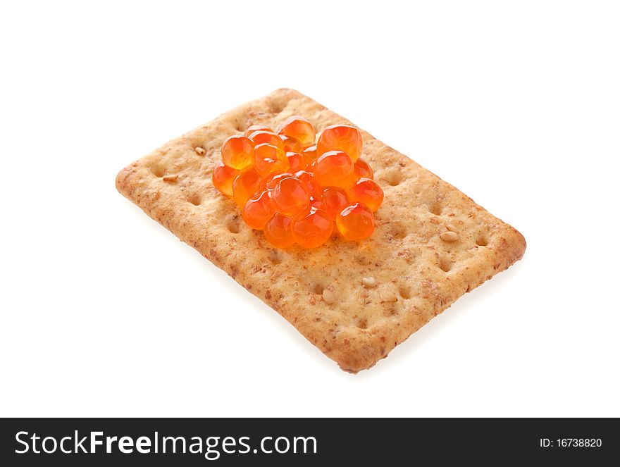 Cracker with red caviar isolated. Cracker with red caviar isolated