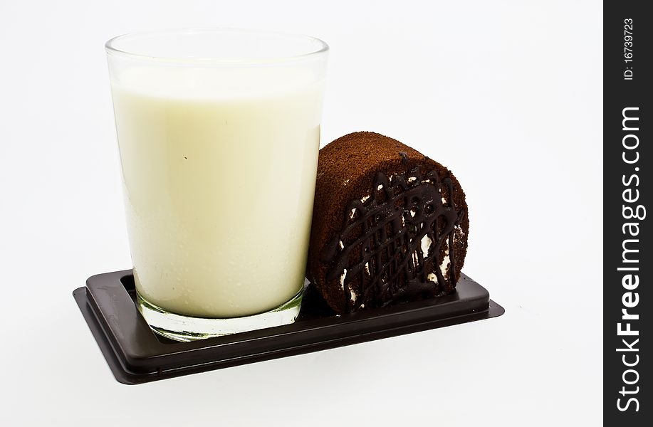 Milk and cake on white background.