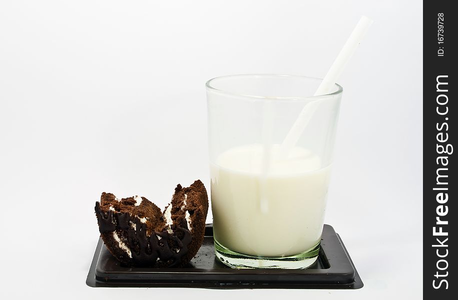 Milk and cake on white background.