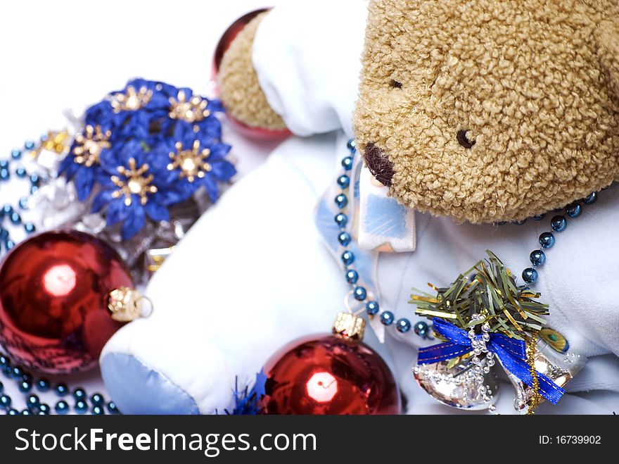Soft bear with Christmas balls, bells, flowers and garland. Soft bear with Christmas balls, bells, flowers and garland