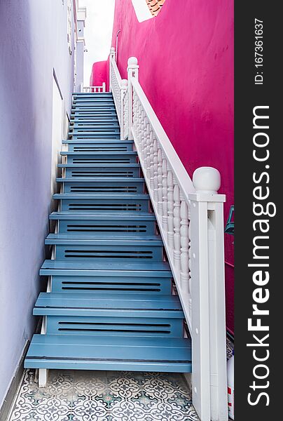 Bright blue wooden staircase and steps