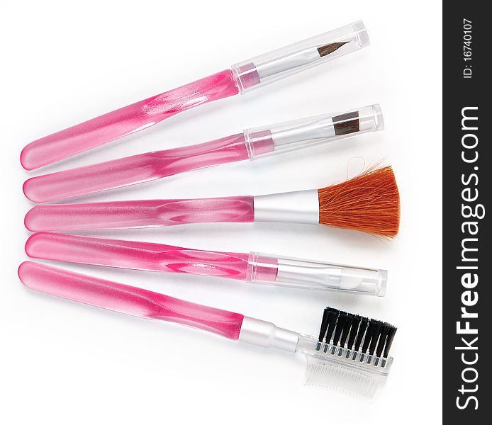 Various cosmetic brushes on a white background. Various cosmetic brushes on a white background