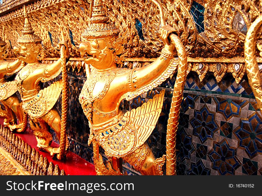 The Golden of Garuda demond guardian around Main Hall Wat Pra Kaew. The Golden of Garuda demond guardian around Main Hall Wat Pra Kaew